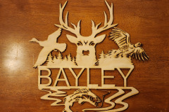 Wall hanging name sign featuring hunting theme